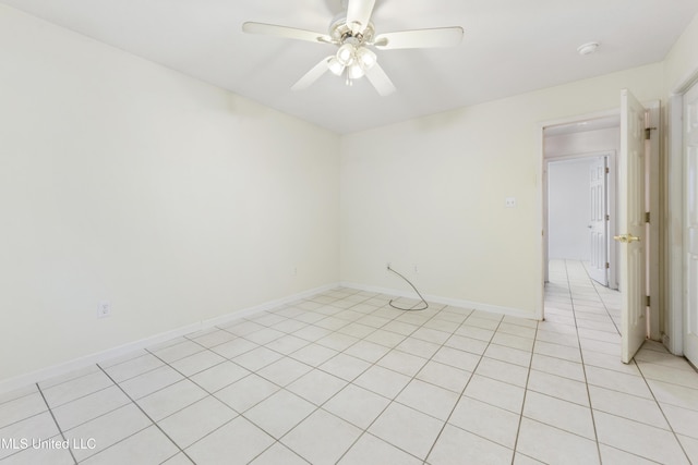 1317 Rosemont Dr, Gautier, MS 39553 - empty room featuring a ceiling fan, light tile patterned flooring, and baseboards
