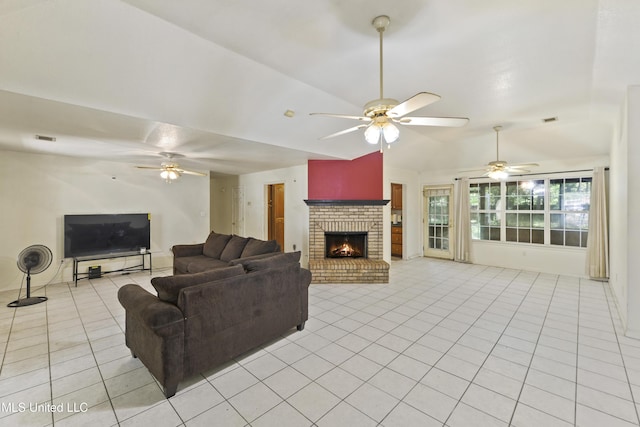 1317 Rosemont Dr, Gautier, MS 39553 - living room featuring light tile patterned floors, ceiling fan, lofted ceiling, and a brick fireplace