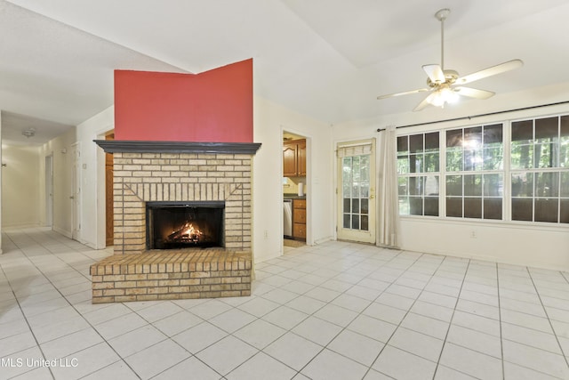 1317 Rosemont Dr, Gautier, MS 39553 - unfurnished living room with lofted ceiling, a ceiling fan, a fireplace, light tile patterned floors, and healthy amount of natural light