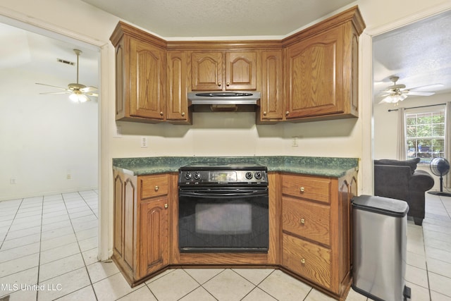 1317 Rosemont Dr, Gautier, MS 39553 - kitchen with black / electric stove, ceiling fan, under cabinet range hood, dark countertops, and a textured ceiling