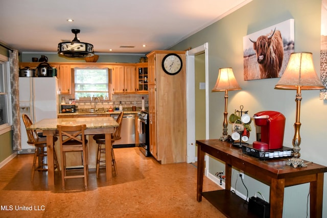 10991 High Rd, Hernando, MS 38632 - kitchen featuring dishwasher, white refrigerator with ice dispenser, tasteful backsplash, a sink, and electric stove