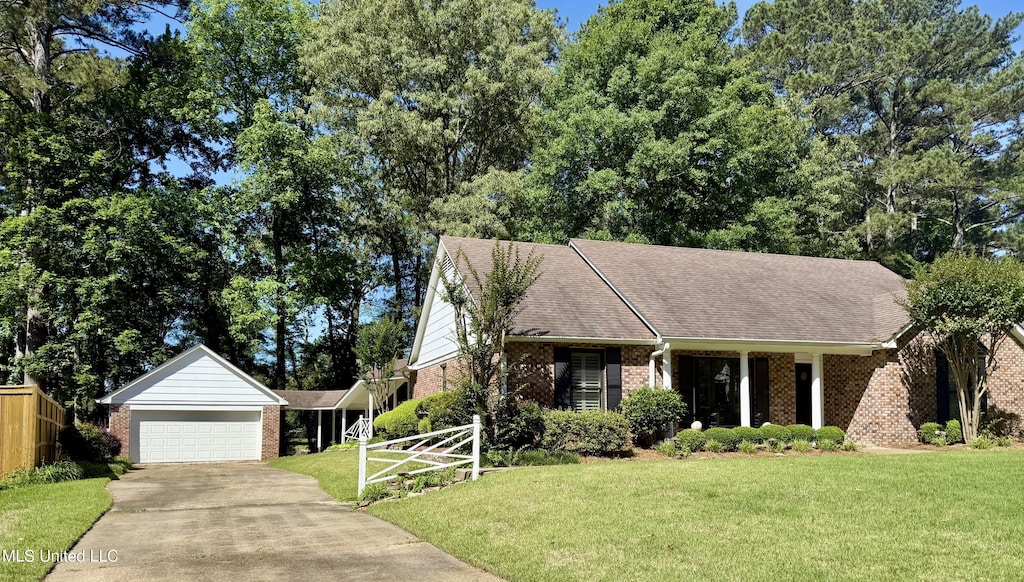697 Country Place Dr, Pearl, MS 39208 - view of front of home with brick siding, a garage, driveway, and roof with shingles