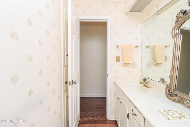 697 Country Place Dr, Pearl, MS 39208 - bathroom featuring vanity, wood finished floors, baseboards, and wallpapered walls