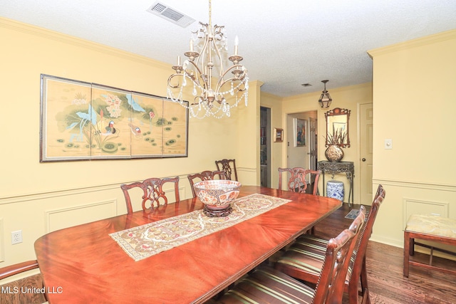 697 Country Place Dr, Pearl, MS 39208 - dining space with wood finished floors, a chandelier, crown molding, and a textured ceiling