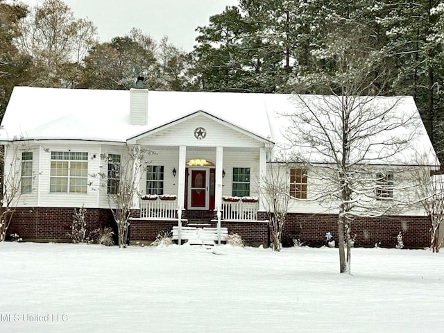 20507 Old Biloxi Rd, Vancleave, MS 39565 - view of front of house featuring a porch and a chimney