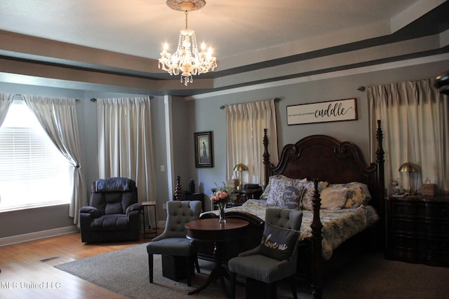 20507 Old Biloxi Rd, Vancleave, MS 39565 - bedroom with a chandelier and wood finished floors