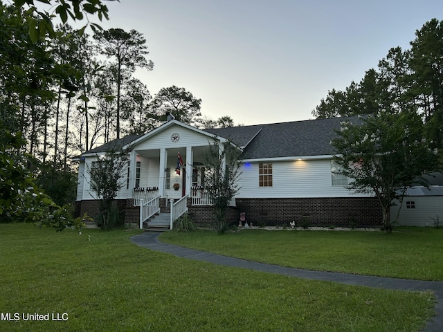20507 Old Biloxi Rd, Vancleave, MS 39565 - view of front of home with covered porch, a front lawn, and roof with shingles