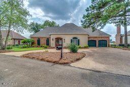 single story home featuring a garage