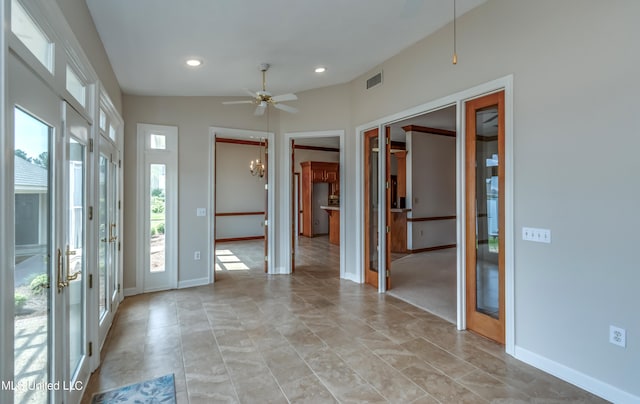 foyer featuring lofted ceiling, french doors, and ceiling fan