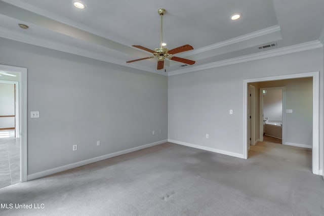 unfurnished room with crown molding, carpet flooring, a raised ceiling, and ceiling fan