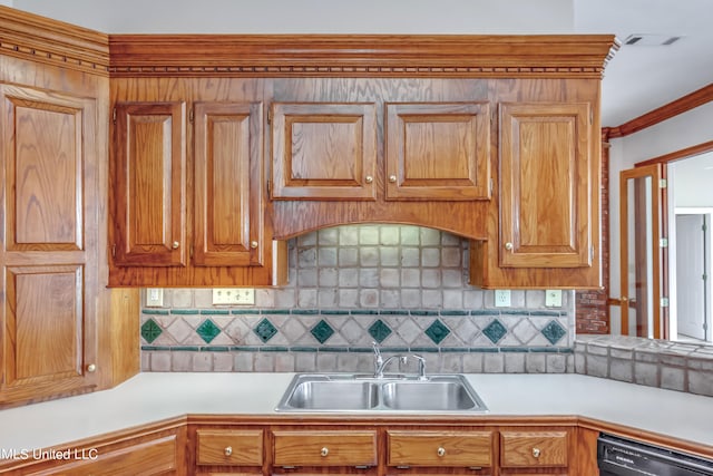 kitchen with sink, dishwasher, and tasteful backsplash