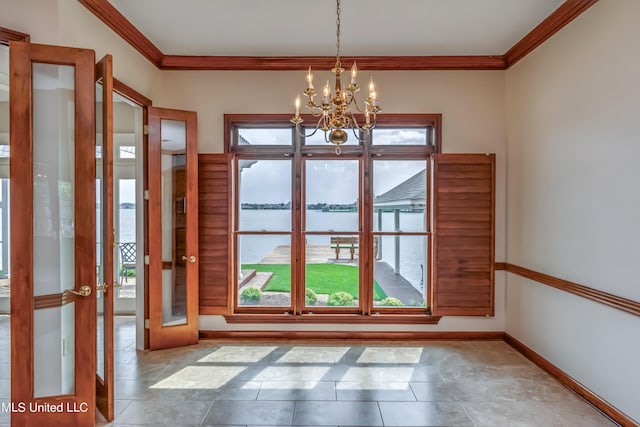 entryway featuring a water view, crown molding, french doors, and an inviting chandelier