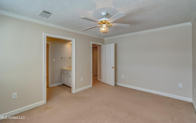 unfurnished bedroom featuring crown molding, light colored carpet, connected bathroom, and ceiling fan