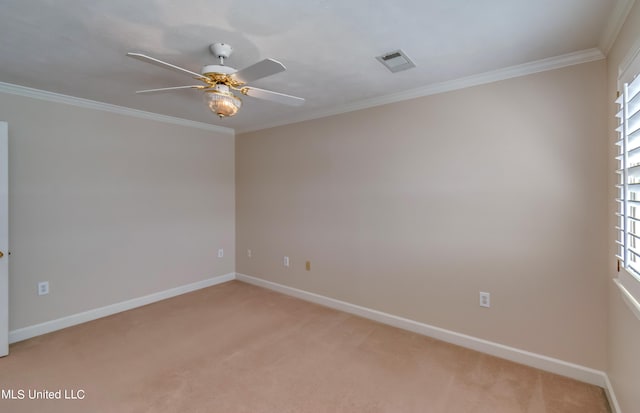 carpeted empty room with crown molding, a healthy amount of sunlight, and ceiling fan