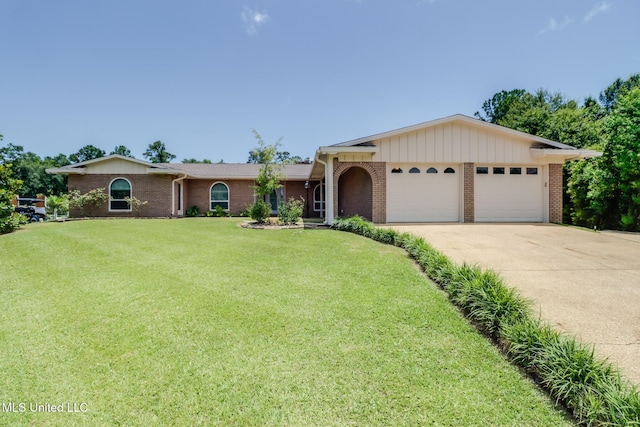 12 Bayou View Dr, Gulfport, MS 39507 - single story home with an attached garage, brick siding, a front yard, and driveway