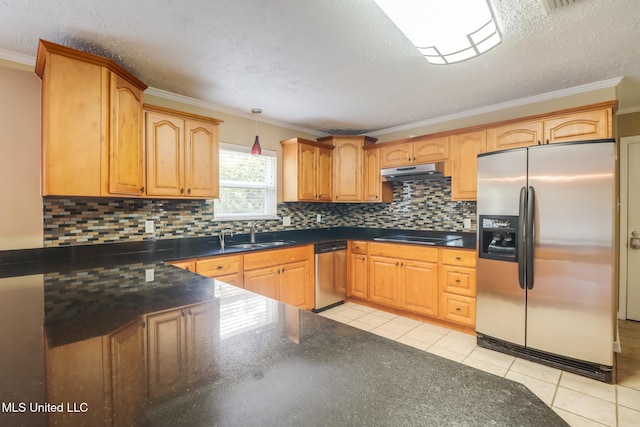 12 Bayou View Dr, Gulfport, MS 39507 - kitchen with appliances with stainless steel finishes, under cabinet range hood, ornamental molding, tasteful backsplash, and light tile patterned floors