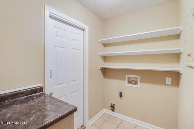 12 Bayou View Dr, Gulfport, MS 39507 - washroom featuring washer hookup, light tile patterned floors, electric dryer hookup, and a textured ceiling