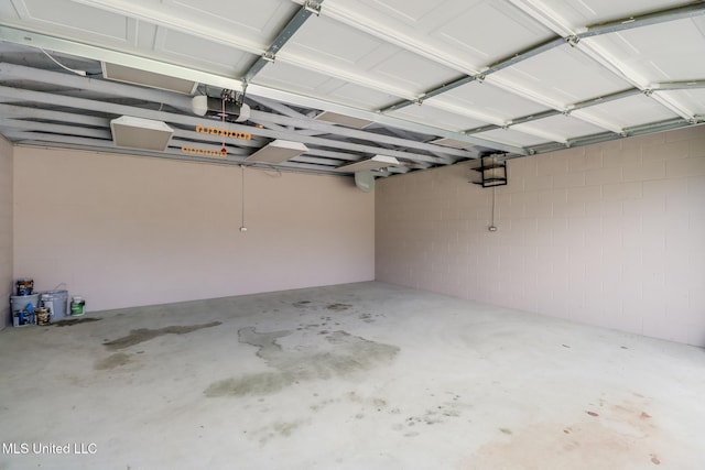 12 Bayou View Dr, Gulfport, MS 39507 - garage with a garage door opener and concrete block wall