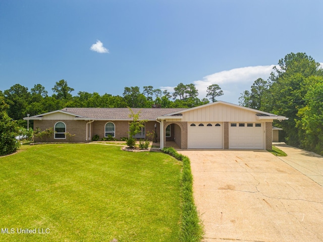 12 Bayou View Dr, Gulfport, MS 39507 - single story home featuring brick siding, a garage, concrete driveway, and a front lawn