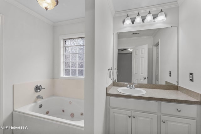 full bathroom featuring a tub with jets, visible vents, ornamental molding, and vanity