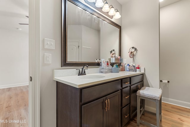 bathroom with vanity and wood-type flooring