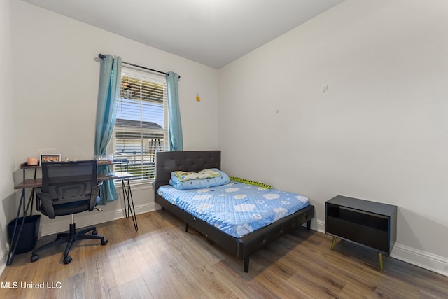 bedroom featuring wood-type flooring