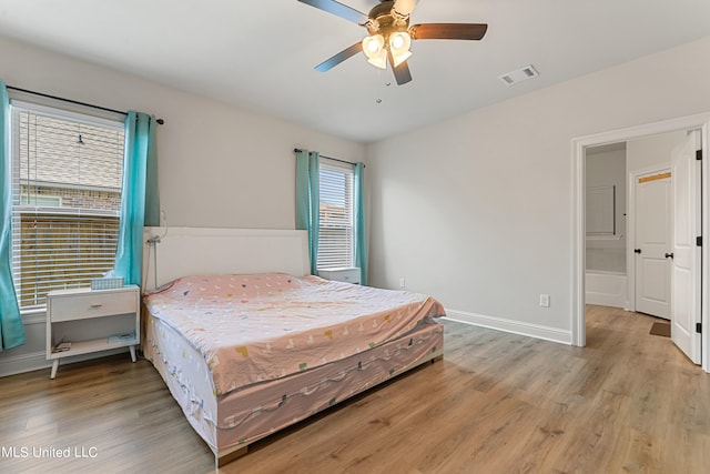 bedroom featuring light wood-type flooring and ceiling fan