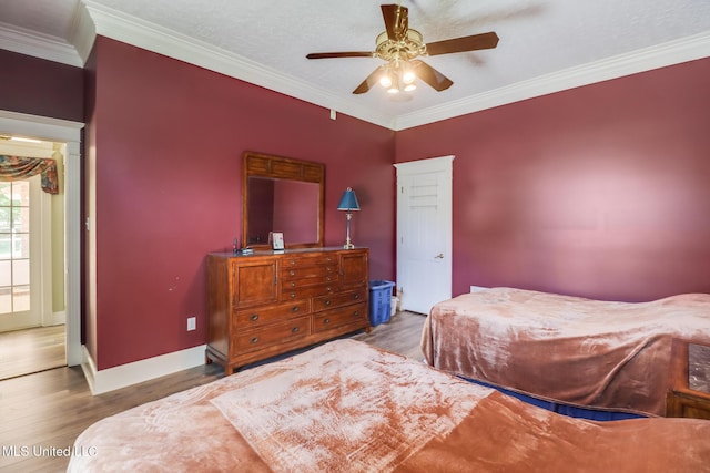 41 C G Evans Rd, Wiggins, MS 39577 - bedroom featuring ceiling fan, baseboards, crown molding, and wood finished floors
