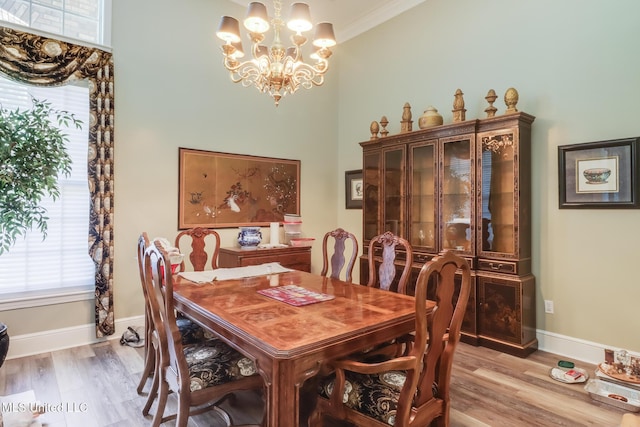 41 C G Evans Rd, Wiggins, MS 39577 - dining room with baseboards, light wood-style floors, a chandelier, and ornamental molding
