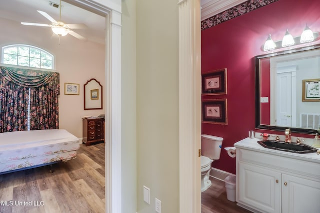 41 C G Evans Rd, Wiggins, MS 39577 - bedroom with baseboards, wood finished floors, visible vents, and a sink