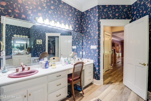 41 C G Evans Rd, Wiggins, MS 39577 - full bath featuring wallpapered walls, wood finished floors, vanity, and crown molding