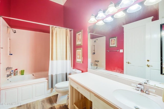 41 C G Evans Rd, Wiggins, MS 39577 - bathroom featuring shower / tub combo, toilet, vanity, and wood finished floors