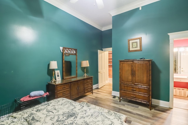 41 C G Evans Rd, Wiggins, MS 39577 - bedroom with baseboards, ornamental molding, wood finished floors, and ensuite bathroom