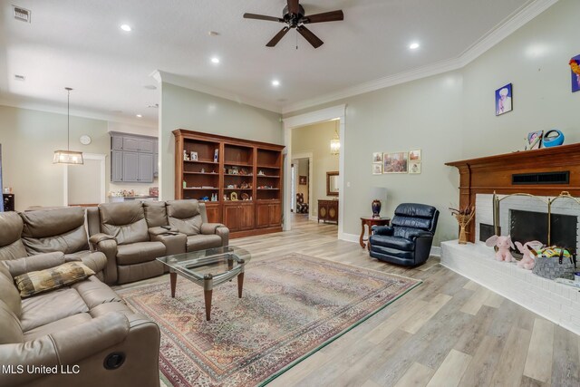 41 C G Evans Rd, Wiggins, MS 39577 - living area with recessed lighting, light wood finished floors, visible vents, a fireplace, and ceiling fan