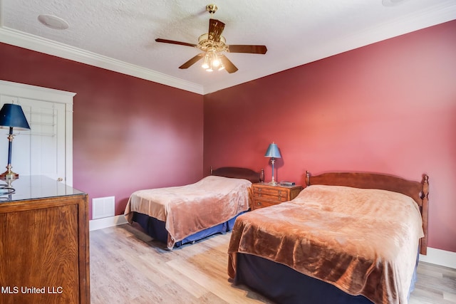 41 C G Evans Rd, Wiggins, MS 39577 - bedroom featuring visible vents, light wood finished floors, baseboards, and ornamental molding