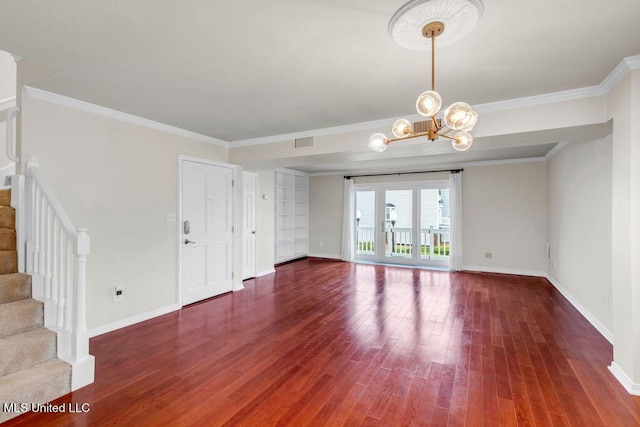 unfurnished living room with stairs, wood finished floors, baseboards, a chandelier, and ornamental molding