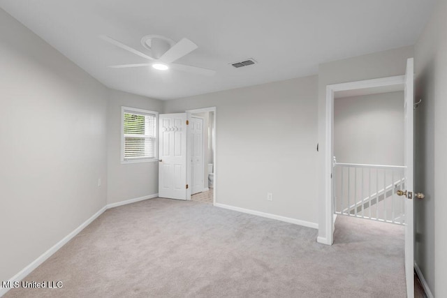 unfurnished bedroom with carpet, baseboards, and ceiling fan