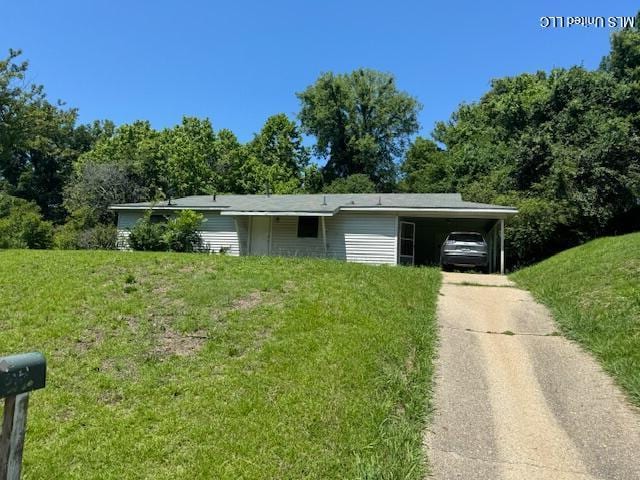 205 Hillside Dr, Vicksburg, MS 39180 - view of front facade with driveway, an attached carport, and a front lawn