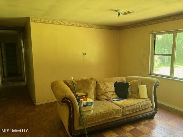 205 Hillside Dr, Vicksburg, MS 39180 - living room featuring visible vents and baseboards