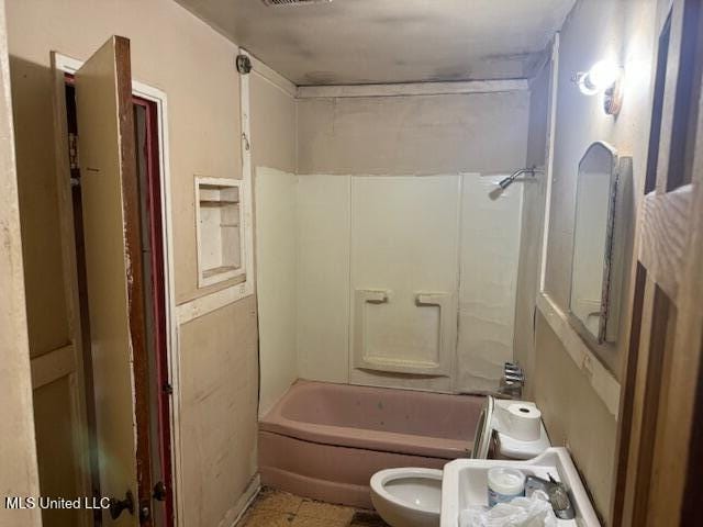 205 Hillside Dr, Vicksburg, MS 39180 - bathroom featuring toilet and  shower combination