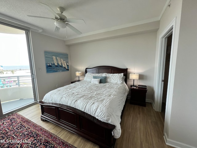 bedroom featuring ceiling fan, hardwood / wood-style flooring, and access to outside