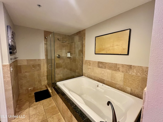 bathroom featuring independent shower and bath and tile patterned flooring