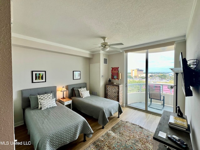 bedroom with ceiling fan, hardwood / wood-style flooring, and access to outside