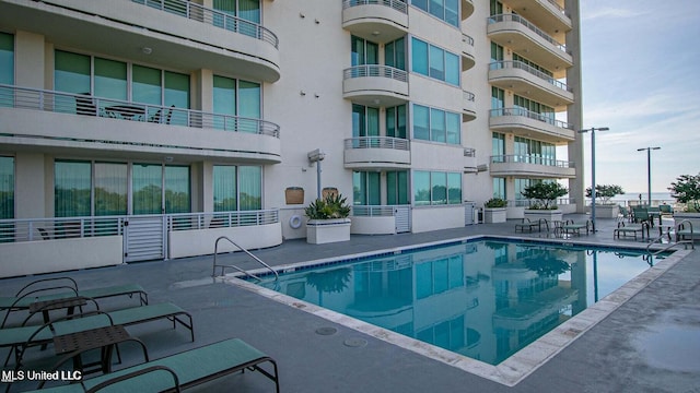 view of swimming pool with a patio area