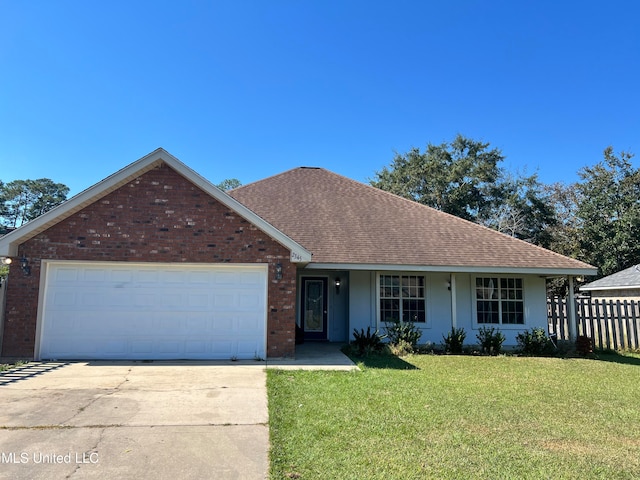 view of front of house featuring a garage and a front lawn