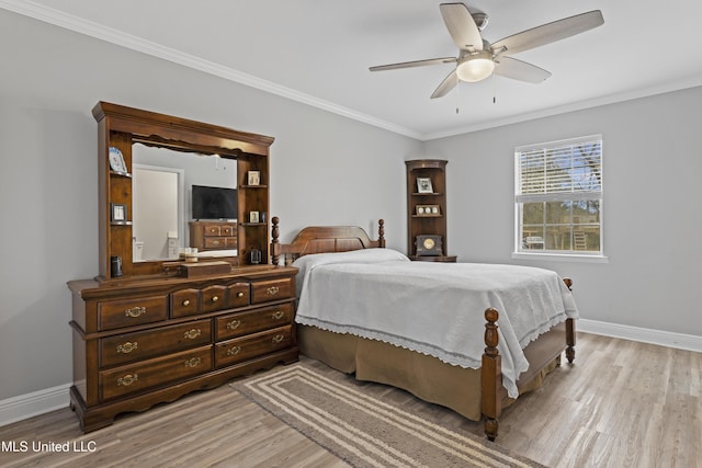 bedroom with light wood-style flooring, baseboards, and ornamental molding