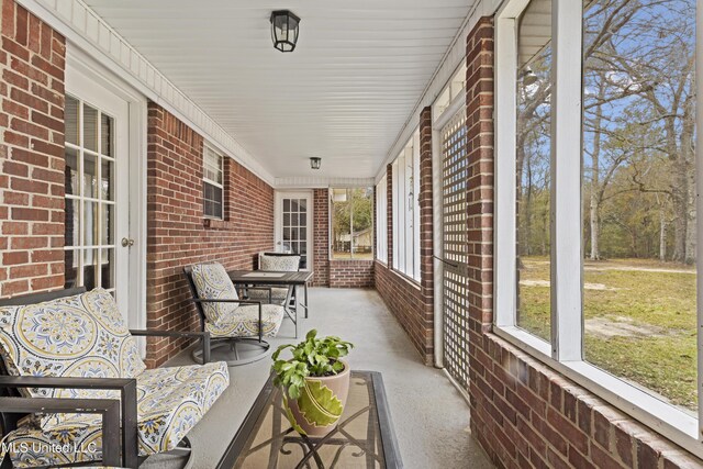 view of patio featuring a porch