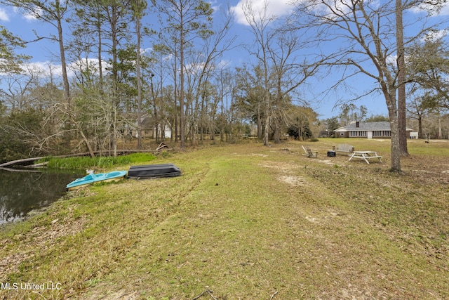 view of yard with a water view