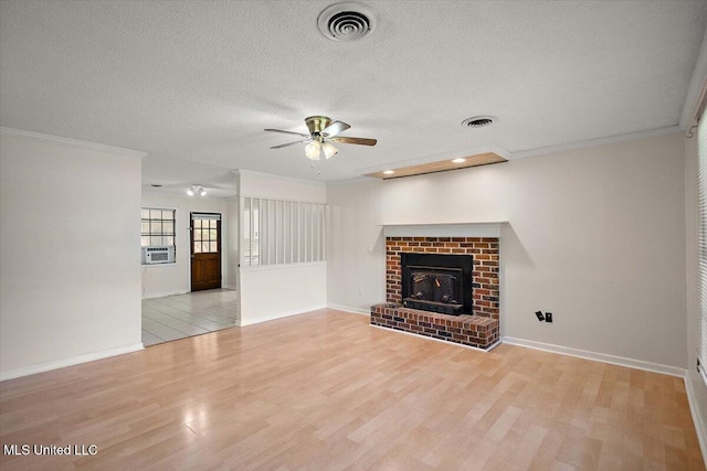 244 Massey Cir, Carthage, MS 39051 - unfurnished living room featuring a ceiling fan, light wood-style floors, cooling unit, a textured ceiling, and ornamental molding