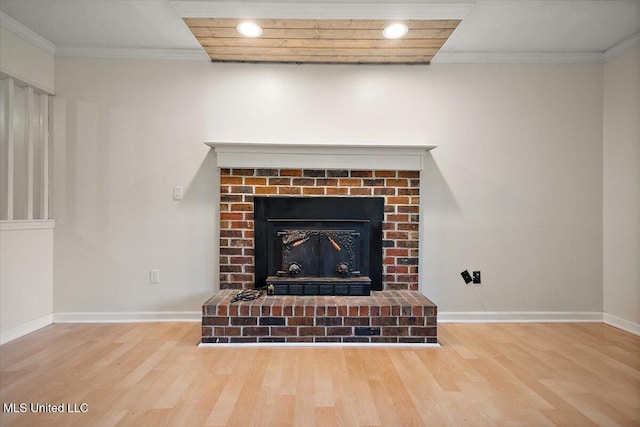 244 Massey Cir, Carthage, MS 39051 - detailed view of a brick fireplace, wood finished floors, baseboards, and ornamental molding